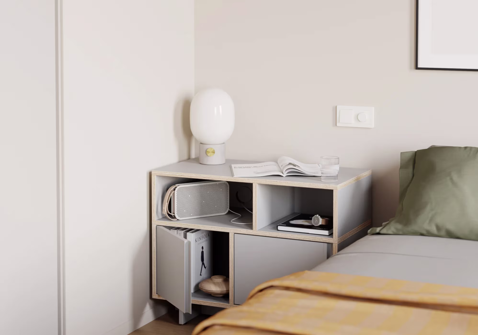 A bedside table in a furnished room