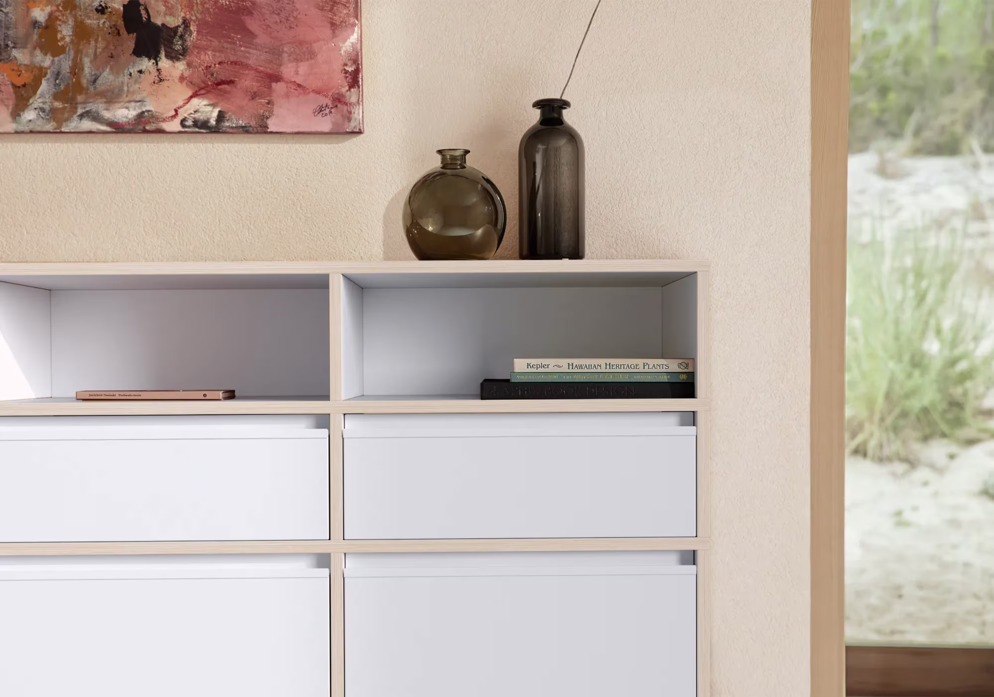 A chest of drawers in a furnished room