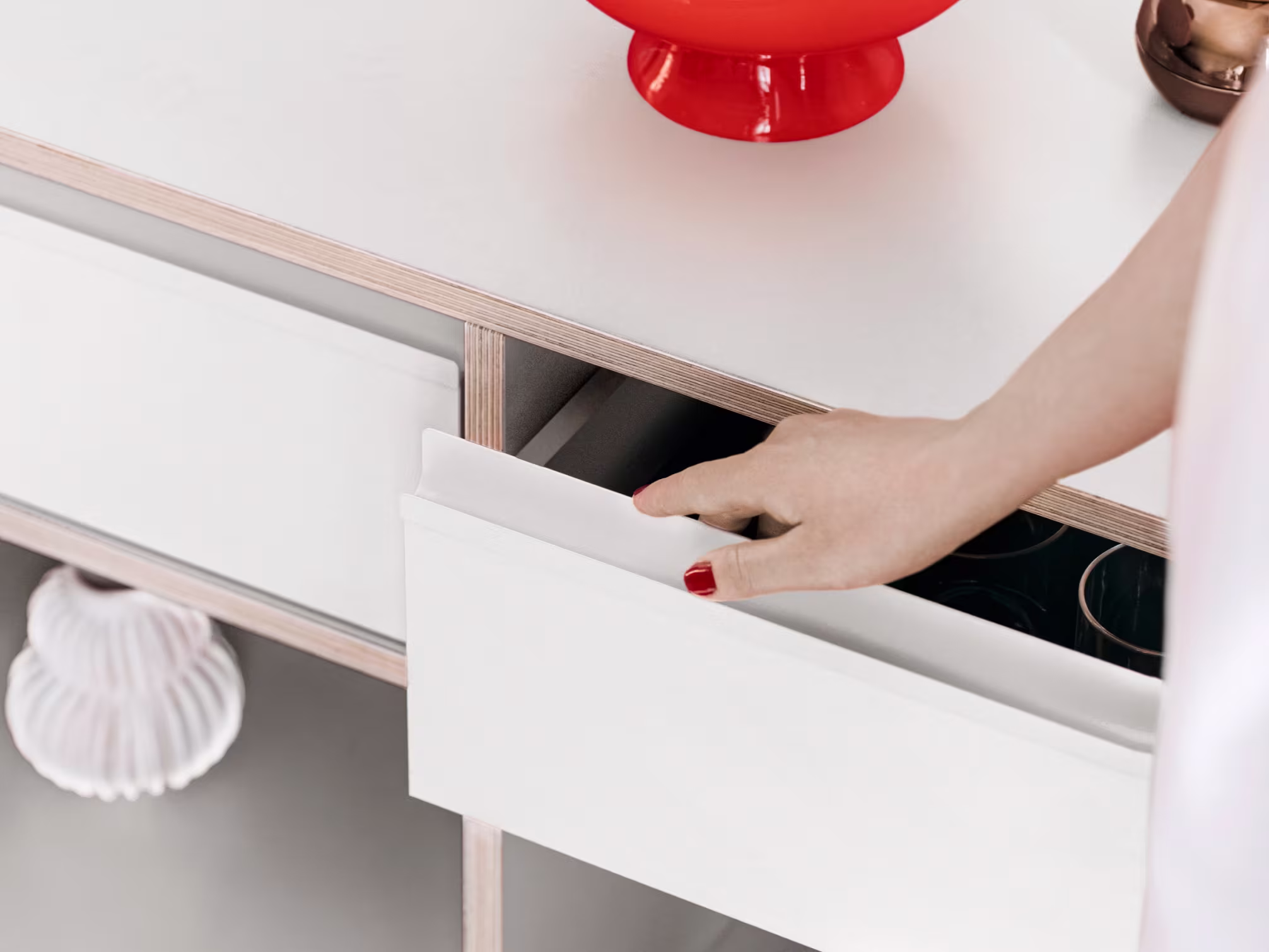 A chest of drawers in a furnished room
