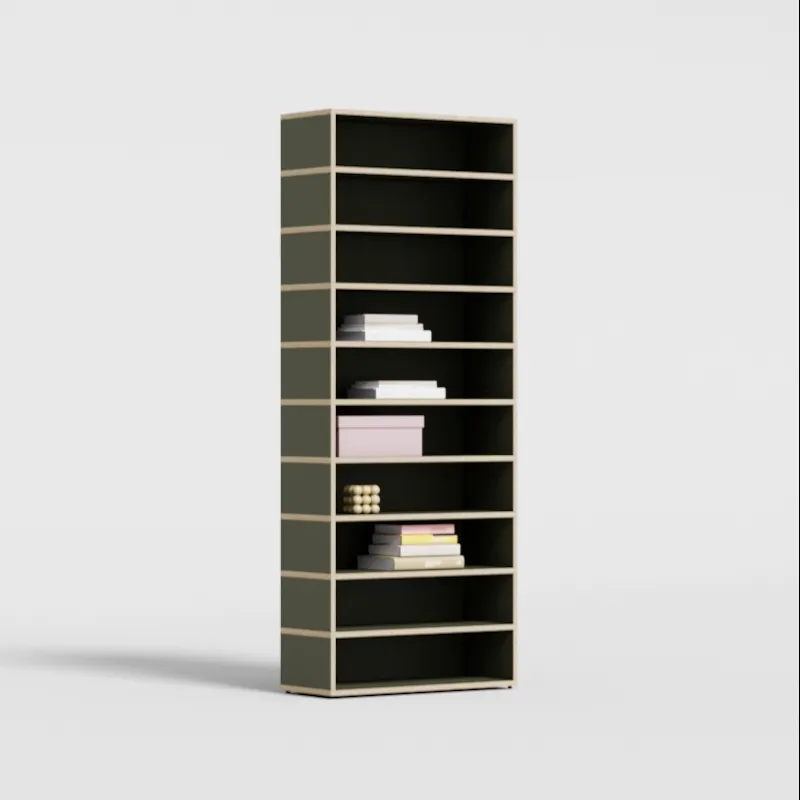 A full-wall black bookcase in a study